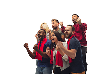 Image showing Multiethnic soccer fans cheering for favourite sport team with bright emotions isolated on white studio background