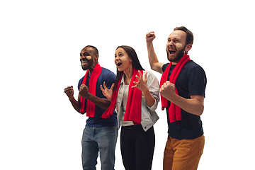 Image showing Multiethnic soccer fans cheering for favourite sport team with bright emotions isolated on white studio background