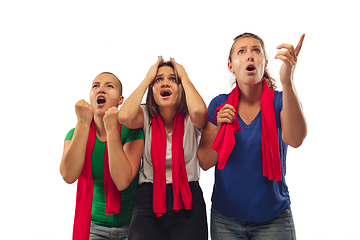 Image showing Female soccer fans cheering for favourite sport team with bright emotions isolated on white studio background