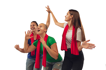 Image showing Female soccer fans cheering for favourite sport team with bright emotions isolated on white studio background