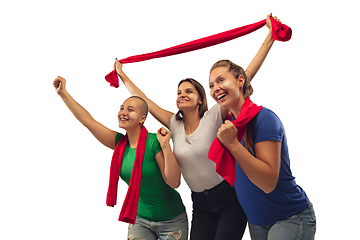 Image showing Female soccer fans cheering for favourite sport team with bright emotions isolated on white studio background