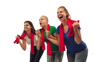 Image showing Female soccer fans cheering for favourite sport team with bright emotions isolated on white studio background