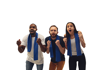 Image showing Multiethnic soccer fans cheering for favourite sport team with bright emotions isolated on white studio background