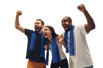 Image showing Multiethnic soccer fans cheering for favourite sport team with bright emotions isolated on white studio background