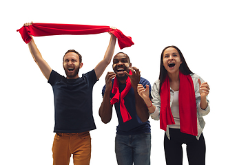 Image showing Multiethnic soccer fans cheering for favourite sport team with bright emotions isolated on white studio background