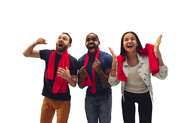 Image showing Multiethnic soccer fans cheering for favourite sport team with bright emotions isolated on white studio background