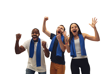 Image showing Multiethnic soccer fans cheering for favourite sport team with bright emotions isolated on white studio background