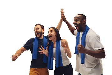 Image showing Multiethnic soccer fans cheering for favourite sport team with bright emotions isolated on white studio background