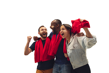 Image showing Multiethnic soccer fans cheering for favourite sport team with bright emotions isolated on white studio background