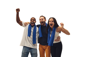 Image showing Multiethnic soccer fans cheering for favourite sport team with bright emotions isolated on white studio background