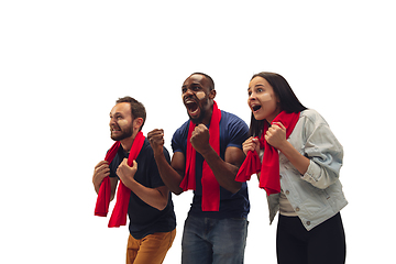 Image showing Multiethnic soccer fans cheering for favourite sport team with bright emotions isolated on white studio background