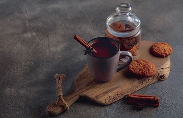 Image showing Cup of tea or coffee with cinnamon and cookies isolated on grey and white background. Copy Space for ad, design.