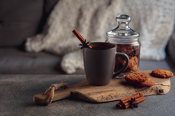 Image showing Cup of tea or coffee with cinnamon and cookies isolated on grey and white background. Copy Space for ad, design.