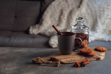 Image showing Cup of tea or coffee with cinnamon and cookies isolated on grey and white background. Copy Space for ad, design.