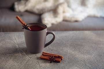 Image showing Closeup cup of tea or coffee with cinnamon isolated on grey and white background. Copy Space for ad, design.