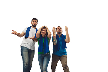 Image showing Two men and woman as soccer fans cheering for favourite sport team with bright emotions isolated on white studio background