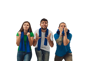 Image showing Female and male soccer fans cheering for favourite sport team with bright emotions isolated on white studio background