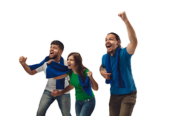 Image showing Two men and woman as soccer fans cheering for favourite sport team with bright emotions isolated on white studio background