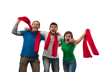 Image showing Female and male soccer fans cheering for favourite sport team with bright emotions isolated on white studio background