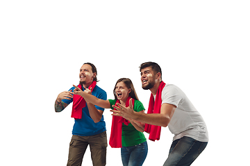 Image showing Female and male soccer fans cheering for favourite sport team with bright emotions isolated on white studio background