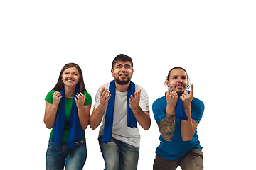 Image showing Female and male soccer fans cheering for favourite sport team with bright emotions isolated on white studio background