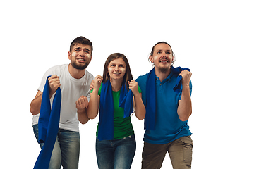 Image showing Female and male soccer fans cheering for favourite sport team with bright emotions isolated on white studio background