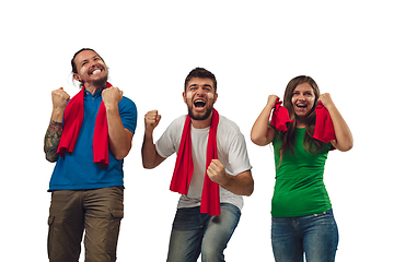 Image showing Female and male soccer fans cheering for favourite sport team with bright emotions isolated on white studio background