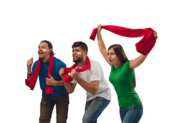 Image showing Female and male soccer fans cheering for favourite sport team with bright emotions isolated on white studio background