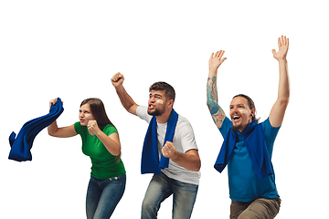 Image showing Female and male soccer fans cheering for favourite sport team with bright emotions isolated on white studio background