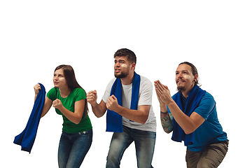 Image showing Female and male soccer fans cheering for favourite sport team with bright emotions isolated on white studio background