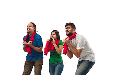 Image showing Female and male soccer fans cheering for favourite sport team with bright emotions isolated on white studio background