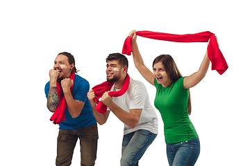 Image showing Female and male soccer fans cheering for favourite sport team with bright emotions isolated on white studio background