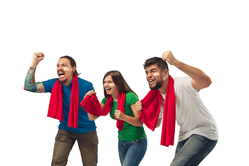 Image showing Female and male soccer fans cheering for favourite sport team with bright emotions isolated on white studio background