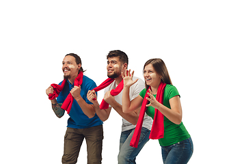 Image showing Female and male soccer fans cheering for favourite sport team with bright emotions isolated on white studio background