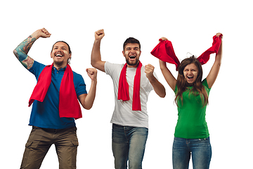 Image showing Female and male soccer fans cheering for favourite sport team with bright emotions isolated on white studio background