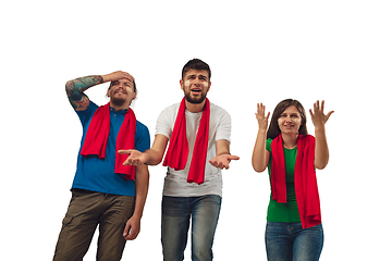 Image showing Two men and woman as soccer fans cheering for favourite sport team with bright emotions isolated on white studio background