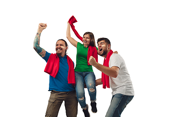 Image showing Female and male soccer fans cheering for favourite sport team with bright emotions isolated on white studio background