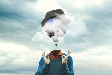 Image showing Contemporary art collage. Male body of model with head full of smoke about sky and clouds.
