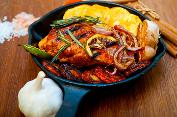 Image showing roasted grilled BBQ chicken breast with herbs and spices