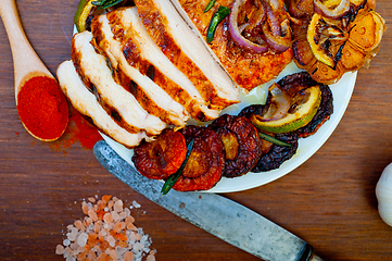 Image showing roasted grilled BBQ chicken breast with herbs and spices