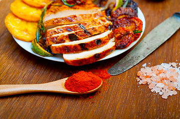 Image showing roasted grilled BBQ chicken breast with herbs and spices