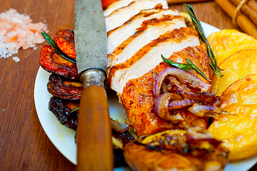 Image showing roasted grilled BBQ chicken breast with herbs and spices