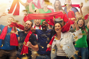 Image showing Group of happy fans are cheering for their team victory. Collage made of 9 models.