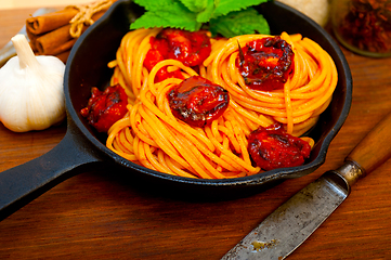 Image showing italian spaghetti pasta and tomato with mint leaves