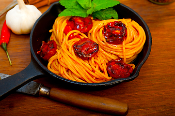 Image showing italian spaghetti pasta and tomato with mint leaves