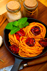 Image showing italian spaghetti pasta and tomato with mint leaves