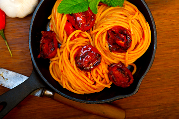 Image showing italian spaghetti pasta and tomato with mint leaves