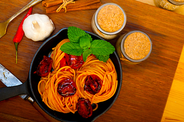 Image showing italian spaghetti pasta and tomato with mint leaves