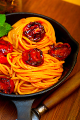 Image showing italian spaghetti pasta and tomato with mint leaves