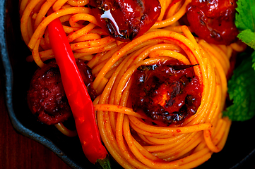 Image showing italian spaghetti pasta and tomato with mint leaves